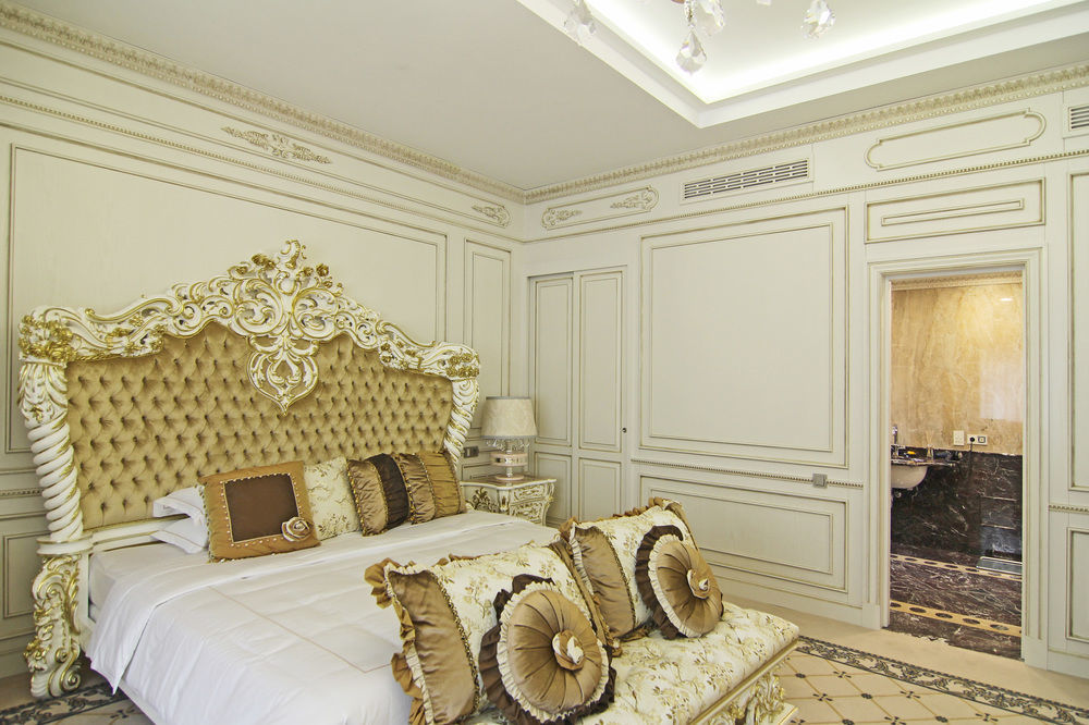 Orion Hotel Biskek Kültér fotó A bedroom in the hotel