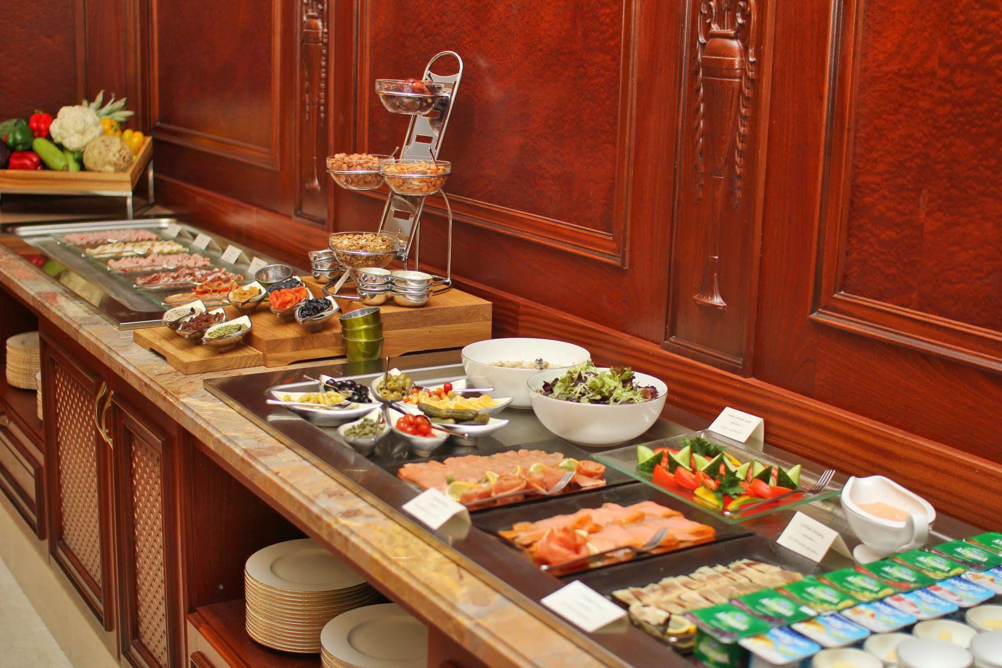 Orion Hotel Biskek Kültér fotó A buffet at a hotel